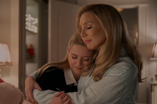Image may contain June Diane Raphael Adult Person Head Face Hugging People and Baby